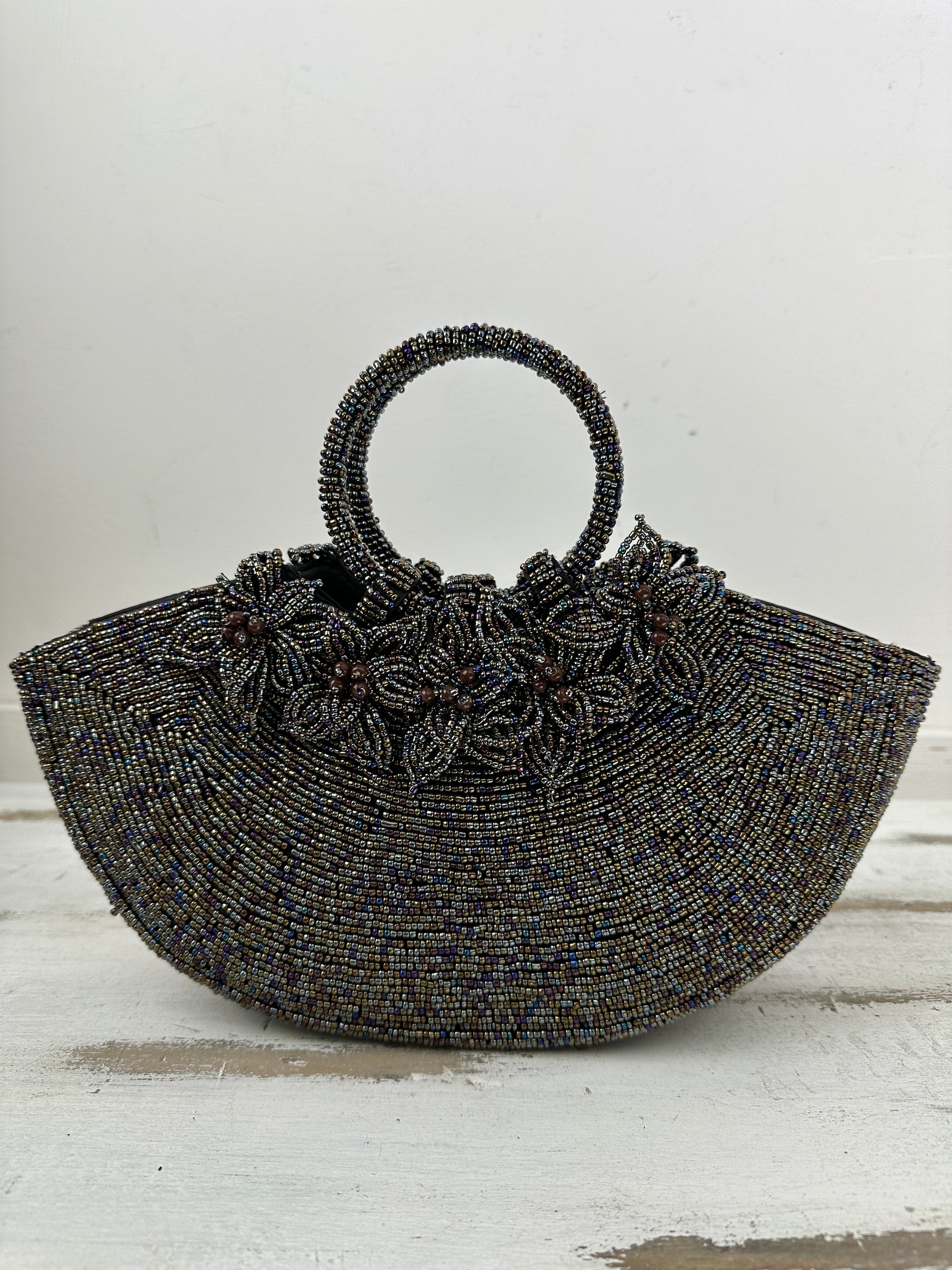 front view of beaded handbag with beaded flowers attatched