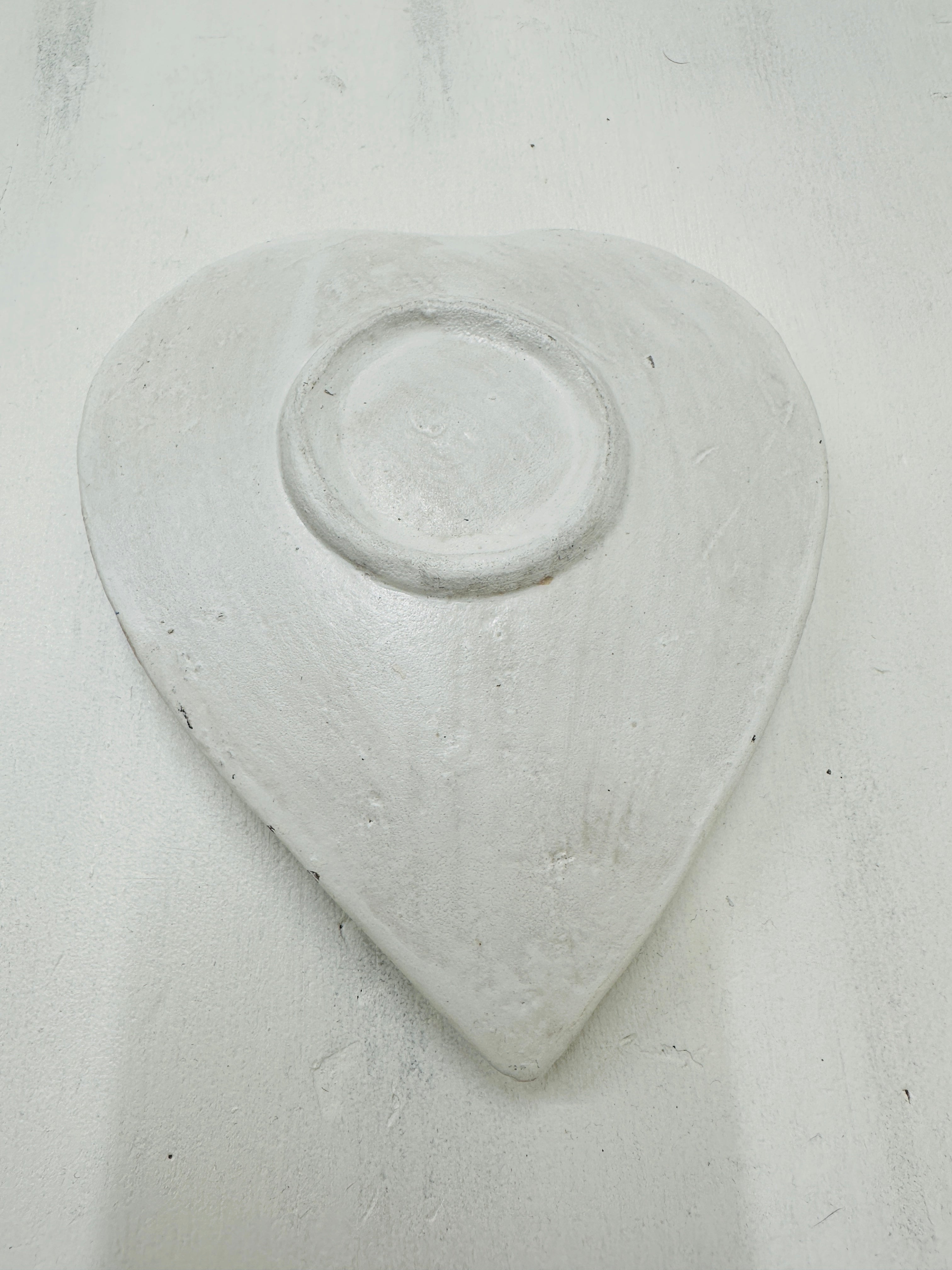 aerial view of base of mosaic heart bowl in white