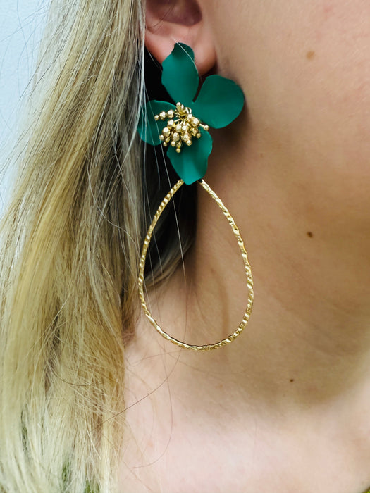 A pair of green floral earrings with a golden drop design.