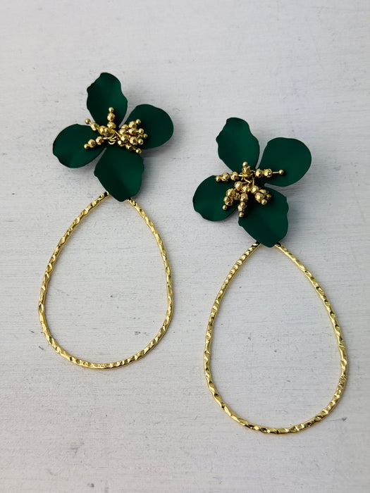 A pair of green floral earrings with a golden drop design.