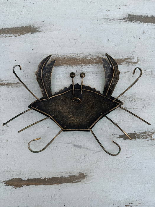 aerial back view of metal crab with hook attached