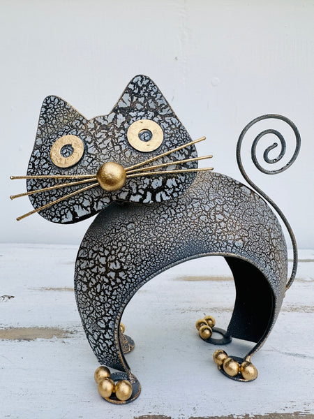 front view of metal crackle white and gold cat archie