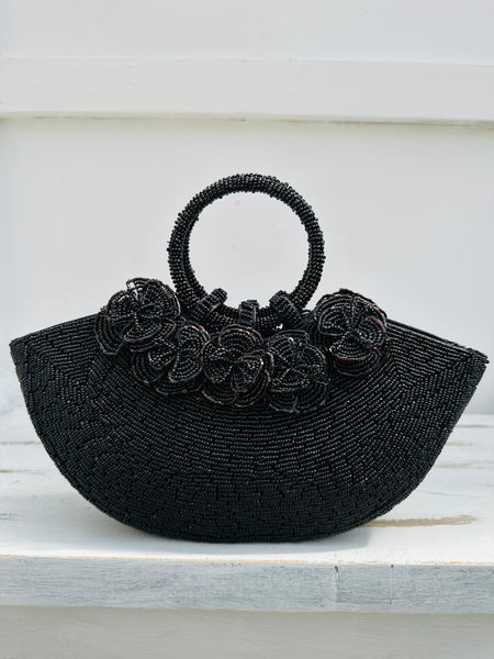 front view of beaded handbag with beaded flowers