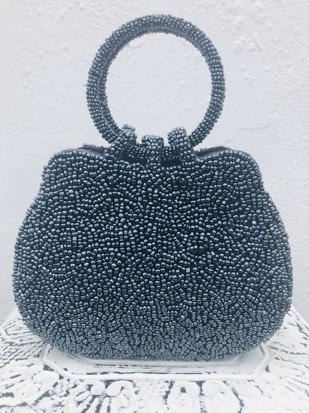 front view of beaded blue handbag