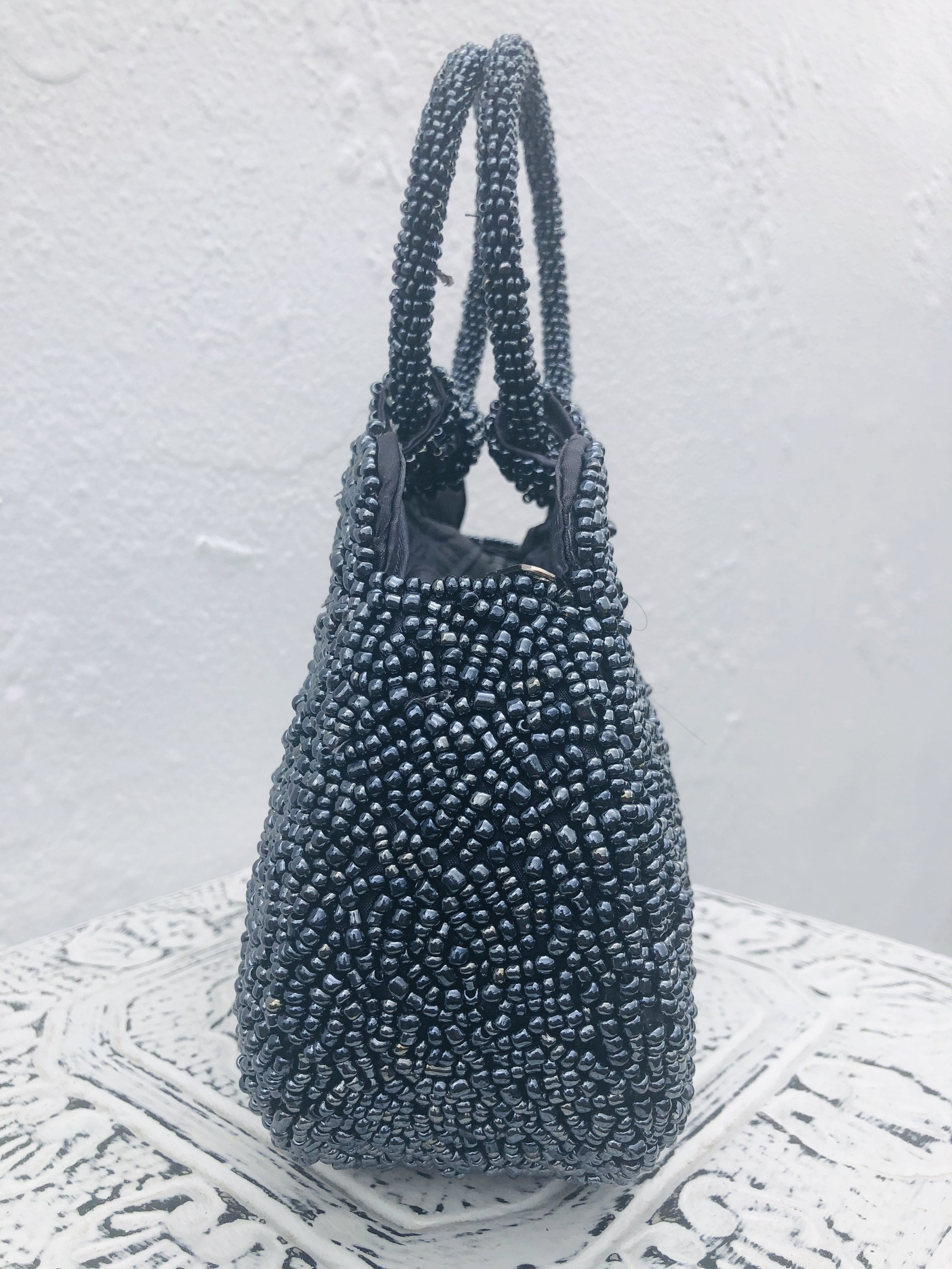 side view of blue beaded handbag