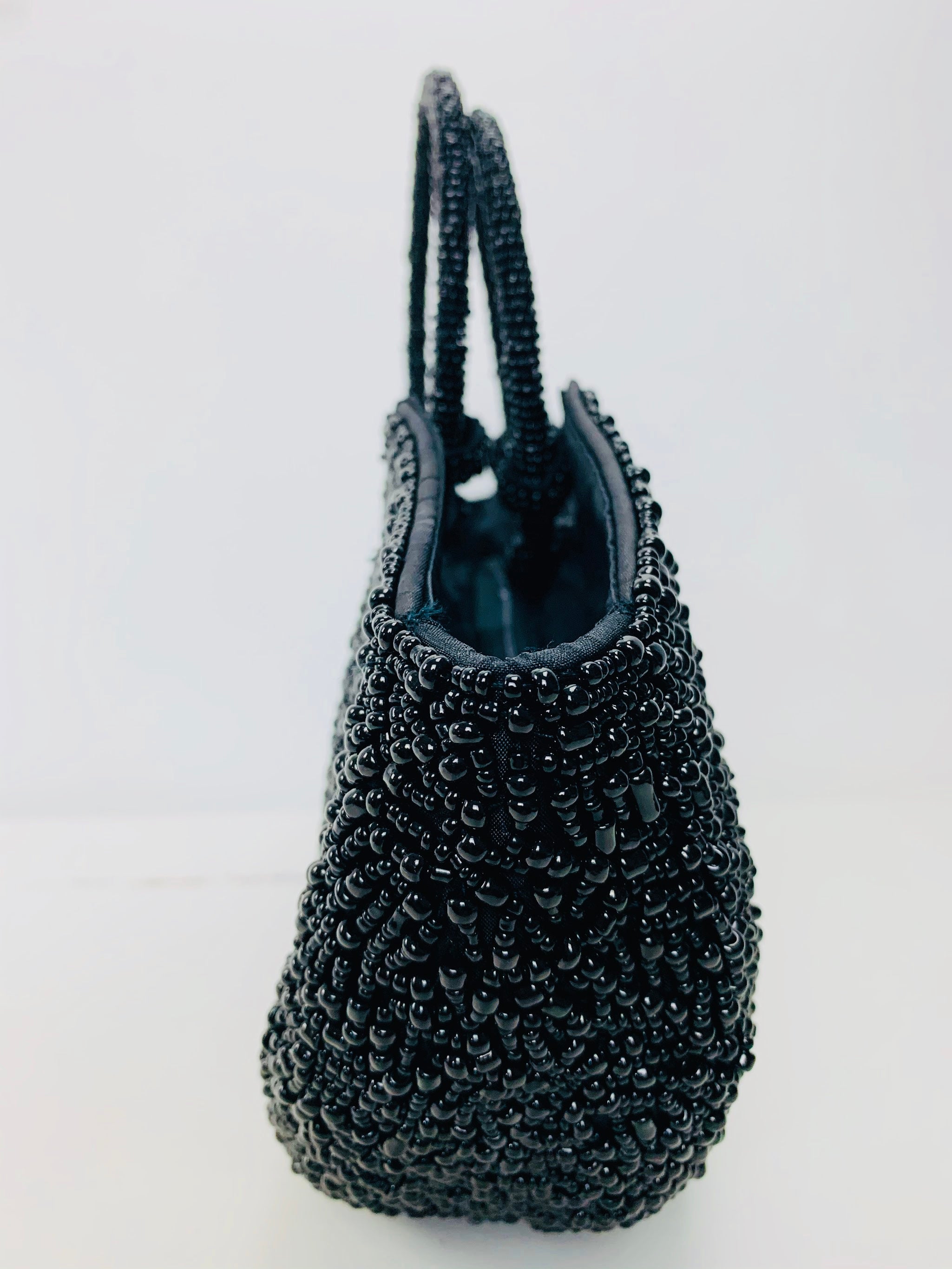 side view of black beaded handbag