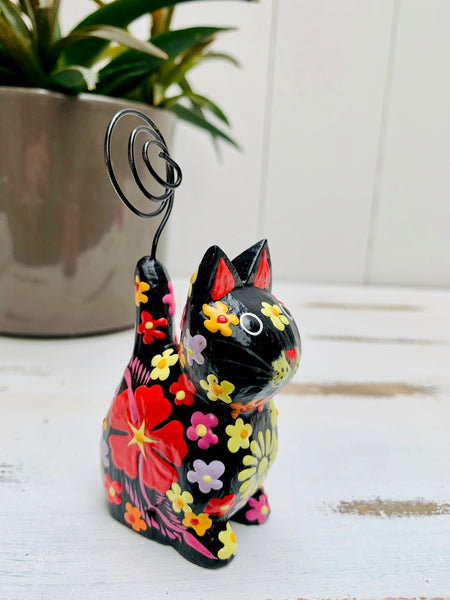 side view of wooden sitting flower kitty