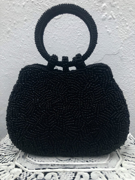 front view of beaded black handbag