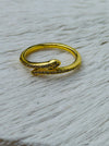 Delicate silver sleek snake ring with fine pave-style detailing and adjustable open band, displayed on a white fabric background.