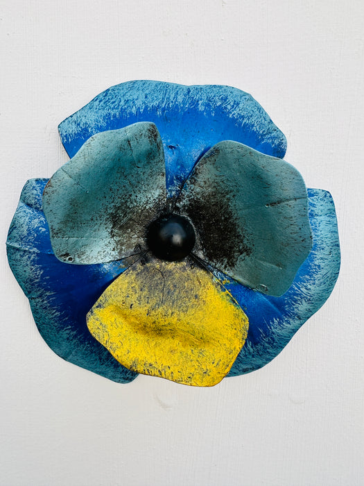 front view of metal pansy flower in blue