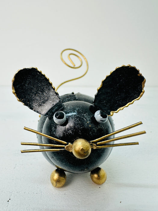 Handmade decorative mouse made from recycled materials with a curly tail, featuring black and gold colors.