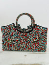 front view of beaded bag on white background