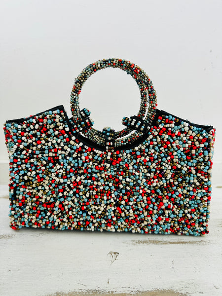 front view of beaded bag on white background