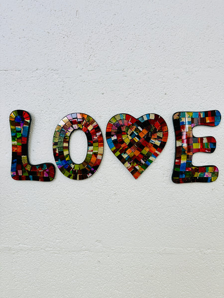 front view of mosaic 'love' letters on white background