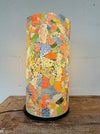 front view of mosaic cylinder lamp with light on
