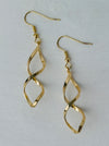 Elegant gold twist earrings with a modern spiral design, displayed on a white background.