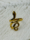 Gold-tone adjustable snake ring with sleek wrap-around design, displayed on a white fabric background.