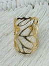 Gold-tone adjustable openwork ring with delicate leaf vein design, displayed on a white background.