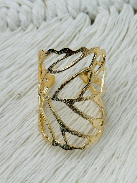 Gold-tone adjustable openwork ring with delicate leaf vein design, displayed on a white background.
