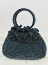 front view of beaded handbag with beaded flowers on bag