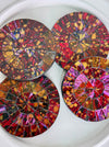 front view of set of four mosaic coasters on white backround