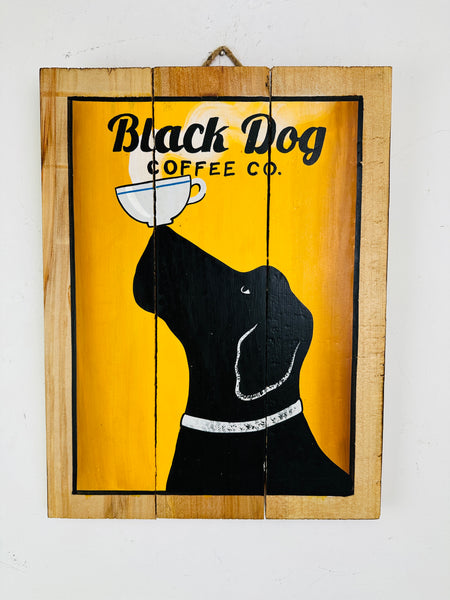front view of wooden sign with dog on it