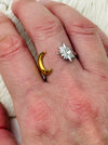 Moon and star open adjustable ring in gold and silver with crystal detail, displayed on a model.