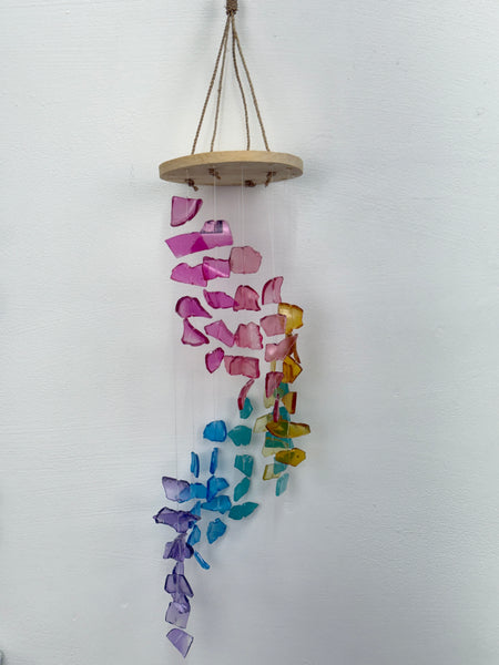 Colorful glass beads on a string against a white background