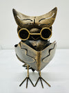 front view of metal owl caspar