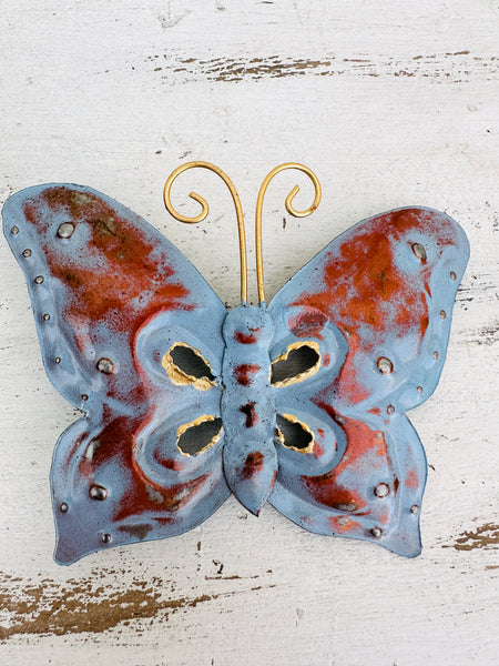 aerial view of metal butterfly in blue