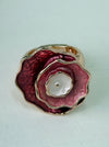 Elastic rose-gold tone ring with layered enamel flower 