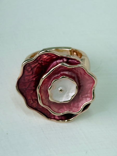 Elastic rose-gold tone ring with layered enamel flower 
