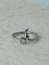 Silver-tone sitting cat adjustable ring with a curled tail.