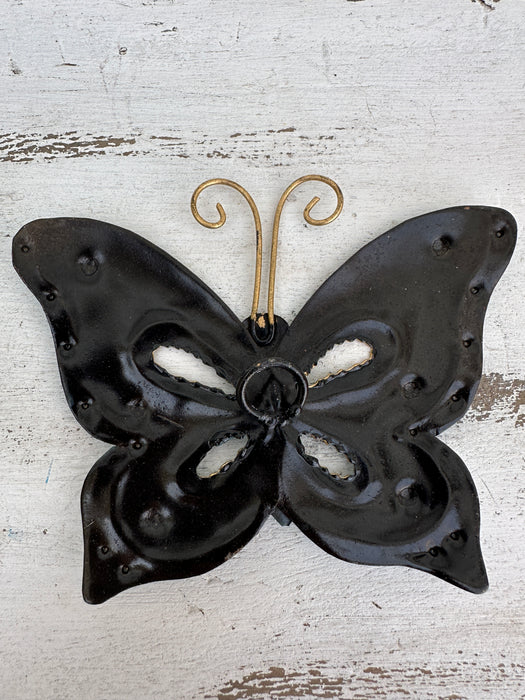 aerial base view of metal butterfly with hook attached