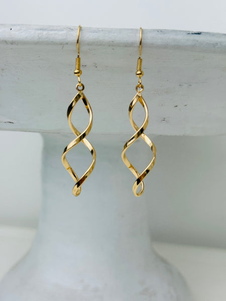 Elegant gold twist earrings with a modern spiral design.