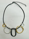 front-of black faux leather necklace with mixed-metal oval links in gold, silver and dark grey tones.