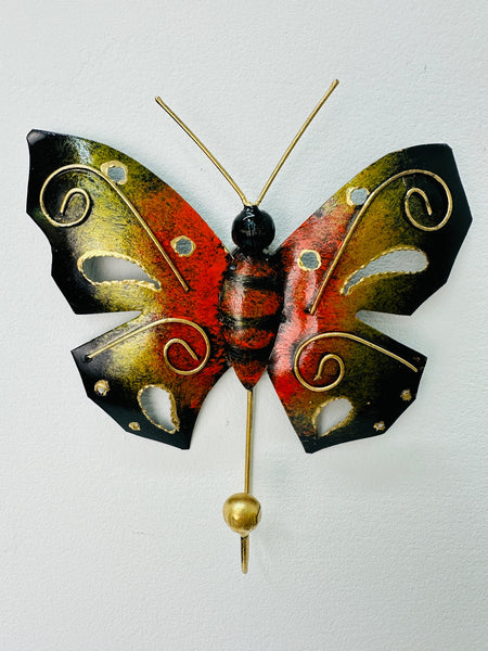Front view of handmade orange butterfly wall hook.