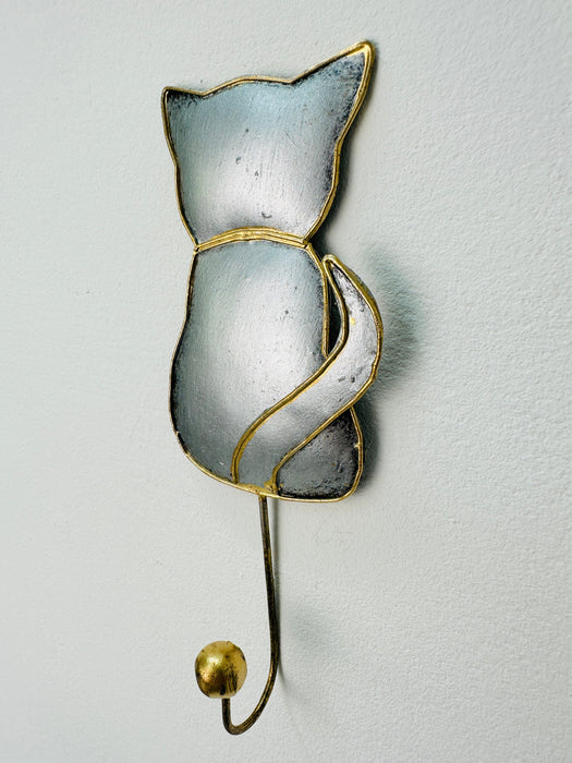 Side view of silver metal cat hook.
