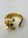 Adorable gold-tone cat hug adjustable ring wrapping around finger, displayed on a white background.