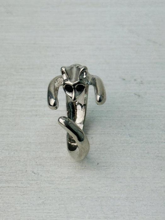 Adorable silver-tone cat hug adjustable ring wrapping around finger, displayed on a white background.