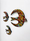 Close-up of colourful mosaic bird wall decor made on MDF base.