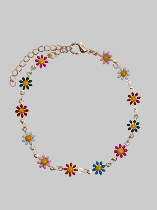 Bracelet with colorful flower-shaped beads on a light gray background