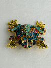 front view of multicoloured crystal frog brooch 