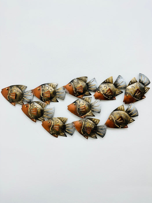 Small copper reef metal fish shoal wall art with 10 fish arranged in a flowing formation
