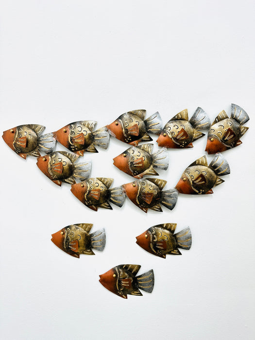 Display view of small copper reef shoal and single fish wall art arranged on a white background