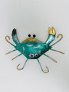 Hand-painted green metal crab wall decoration with curved legs and gold detailing