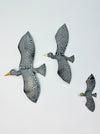 Hand-painted crackle metal seabird set of 3 displayed on wall