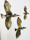 Back view of crackle metal seabird wall art showing hanging eyelet