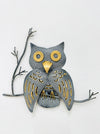 Handmade crackle-effect owl wall art in grey and gold, mounted on a branch against a light background.