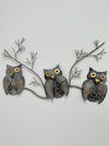 Front view of three crackle-effect metal owls on a branch, hand painted with gold detailing.